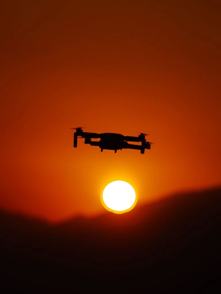 Tethered drone holding station over a border sector at night